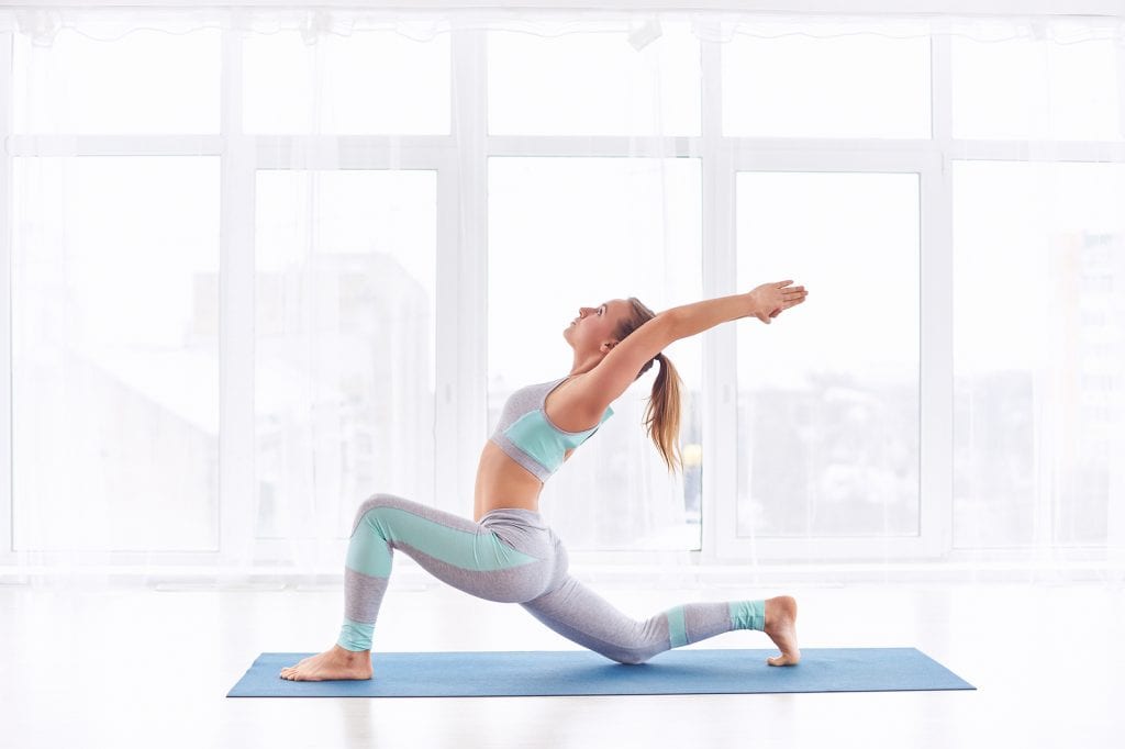 Young woman practices yoga