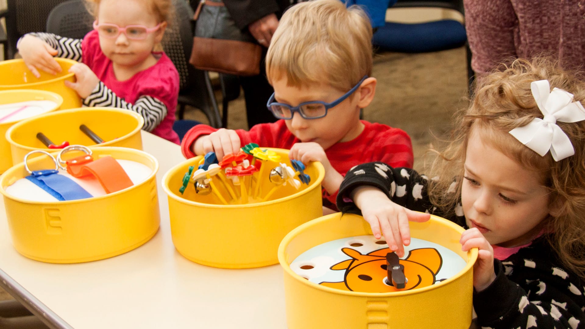 Young children playing with the Fine Motor Development Materials Kit