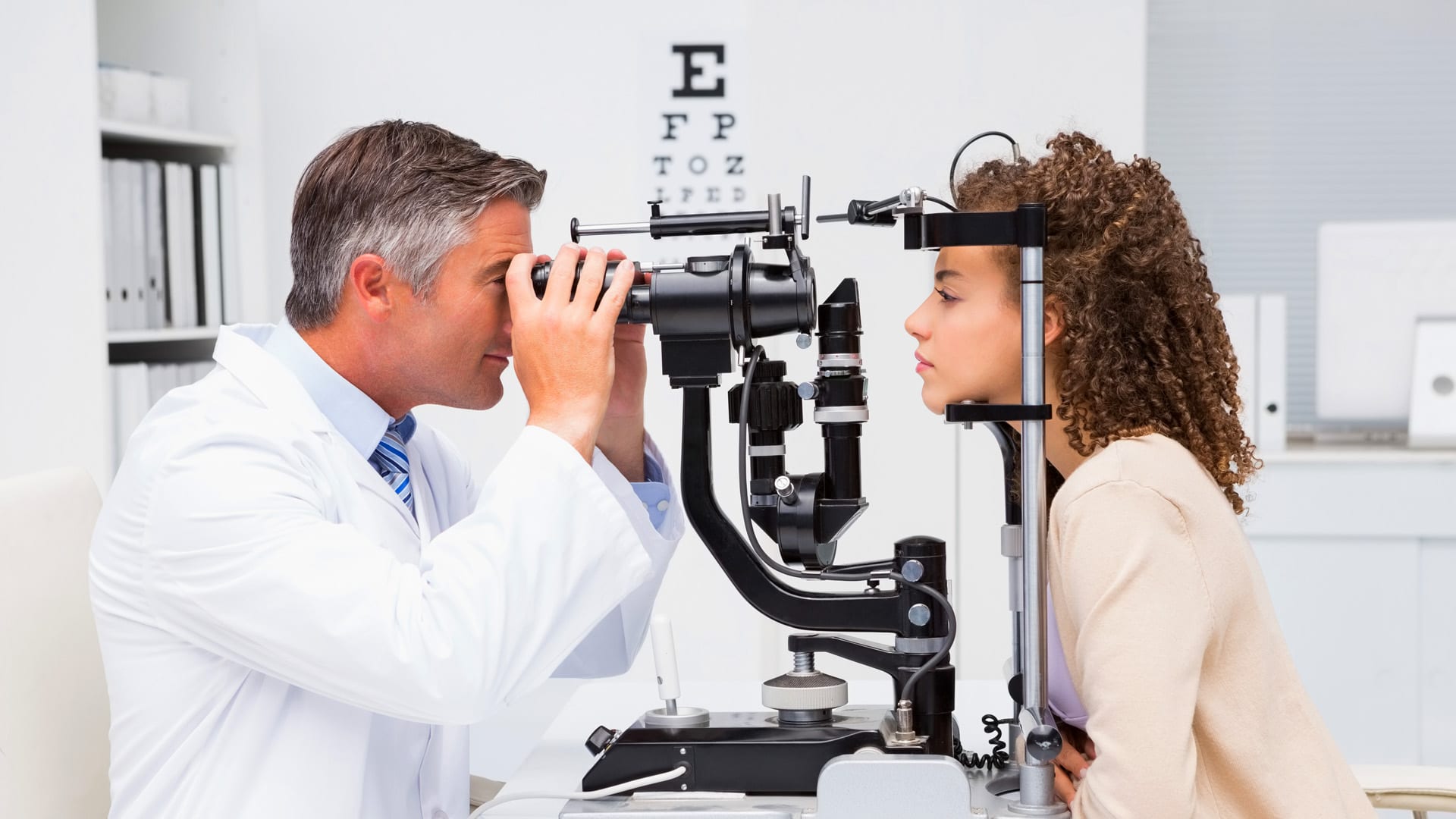 Eye doctor performing an eye exam