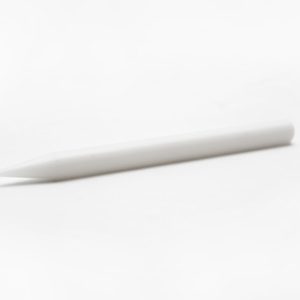White plastic pencil shaped braille eraser with a narrowed end and a flat end.