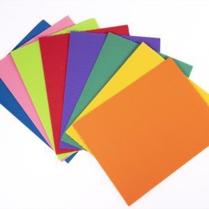 A stack of corrugated sheets in various colors fanned out.