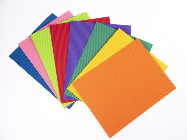 A stack of corrugated sheets in various colors fanned out.