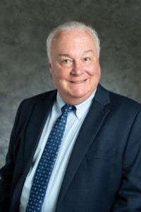 Portrait of Judge David Holton II smiling