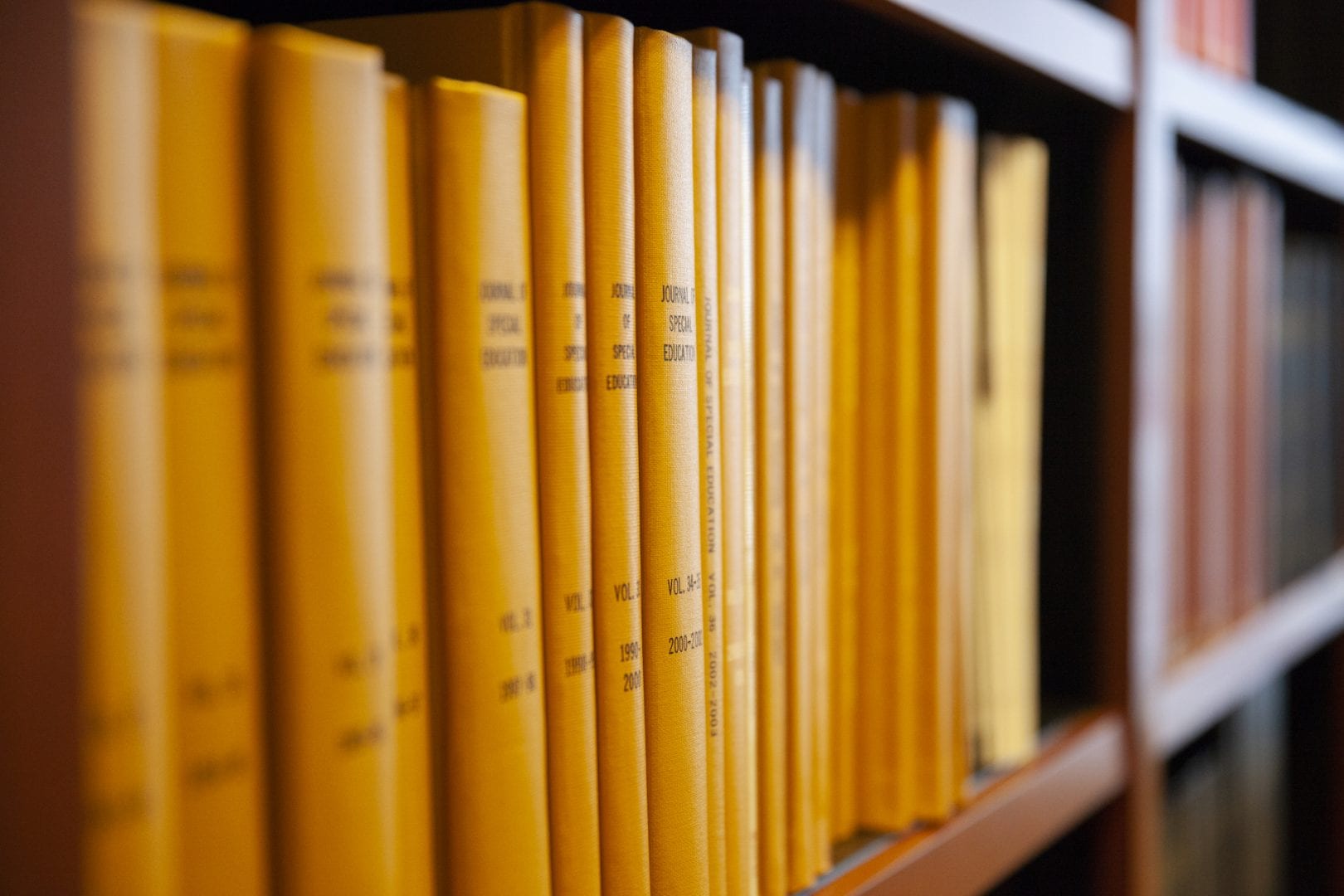 Volumes of books on a shelf at a library