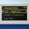 Close up of the Language Setting menu. It displays “Language Setting, Current setting: English-U.E.B., Change to English-A…, Exit Menu.” English U.E.B is selected.