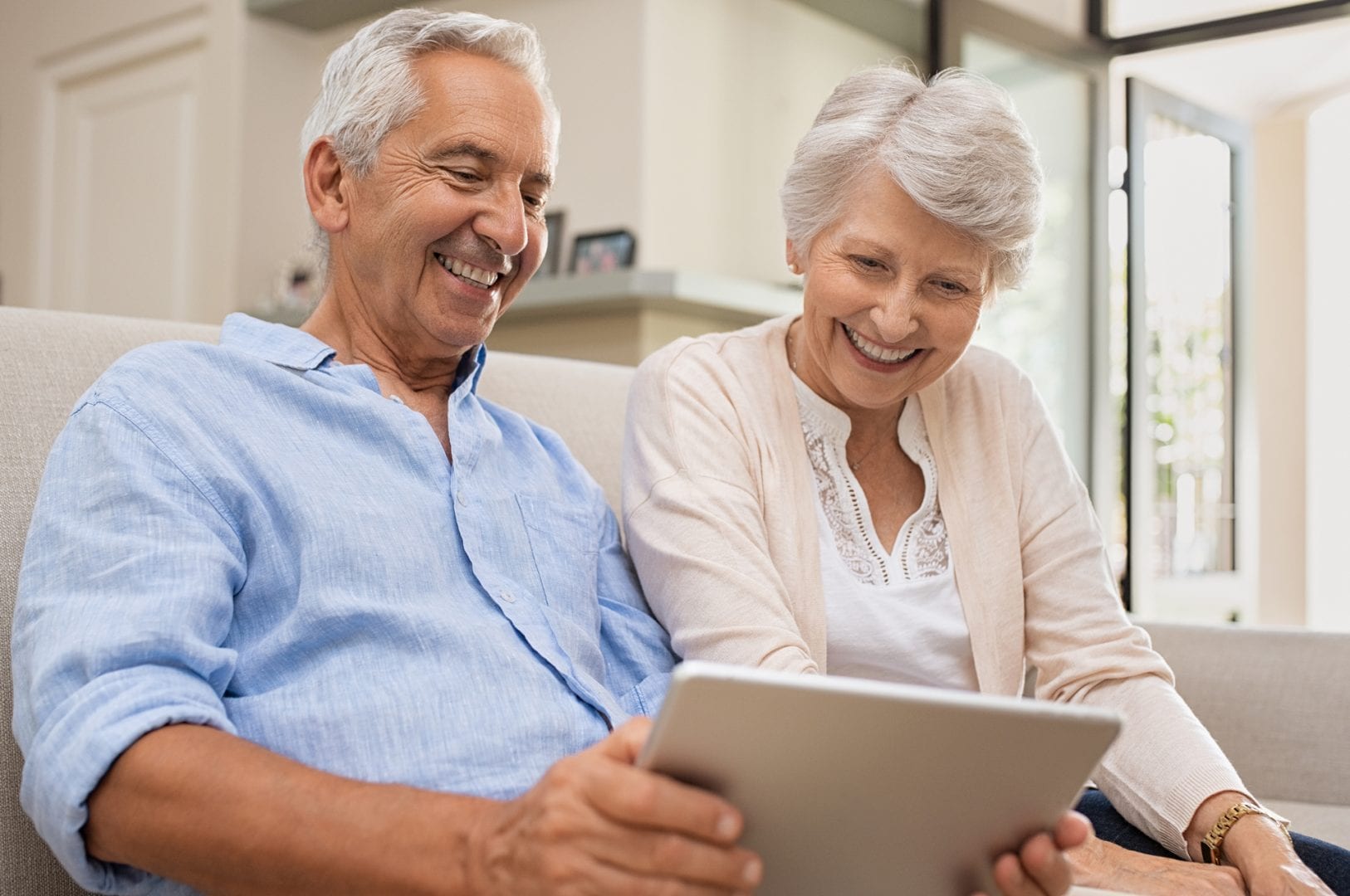 Senior couple using a tablet