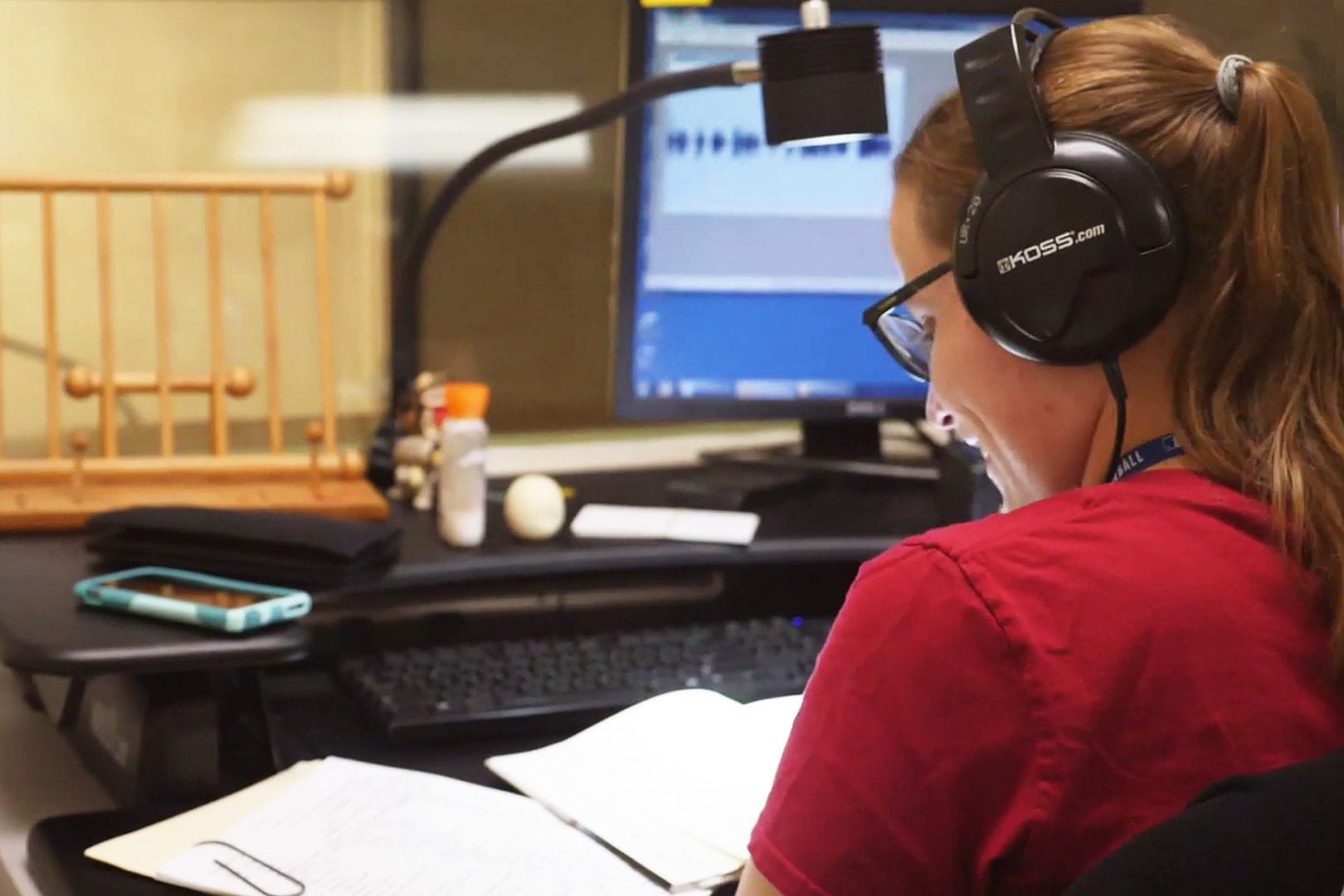 A female worker recording an audio book