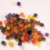 LED mini light box cube set. A pile of several translucent, colorful cubes.