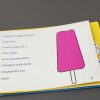 Terrible awful day - A story clipped into the yellow OTWL sound page with two digital device recorders inserted. On the page is an illustration of a pink popsicle next to the large print and braille text.