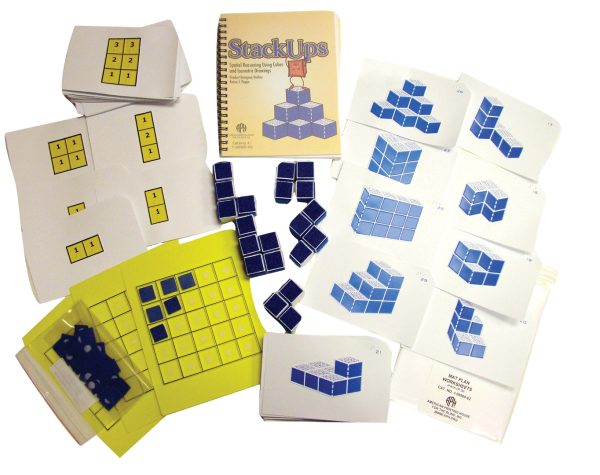 All components of the StackUps kit laid out on a white background. This includes the stacked cube arrangement cards, the raised line grid pack with blue square tiles, the mat plan card set, and a set of 20 blue cubes, as well as the printed manual.