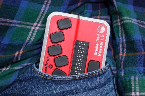 Braille Trail Reader in blue jeans pocket