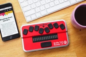 Braille Trail Reader with keyboard and coffee and smartphone