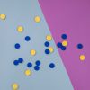 blue and yellow tactile tokens spread on table
