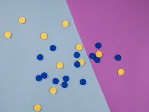 blue and yellow tactile tokens spread on table