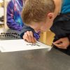 Student making a frequency diagram with the histogram board.
