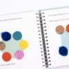 Four Little Corners Displayed Open Spiral Binding