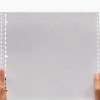 White Fanfold Tractor Feed Braille Transcribing Paper Being Held Close Up