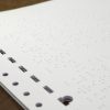 White Fanfold Tractor Feed Braille Transcribing Paper Close up