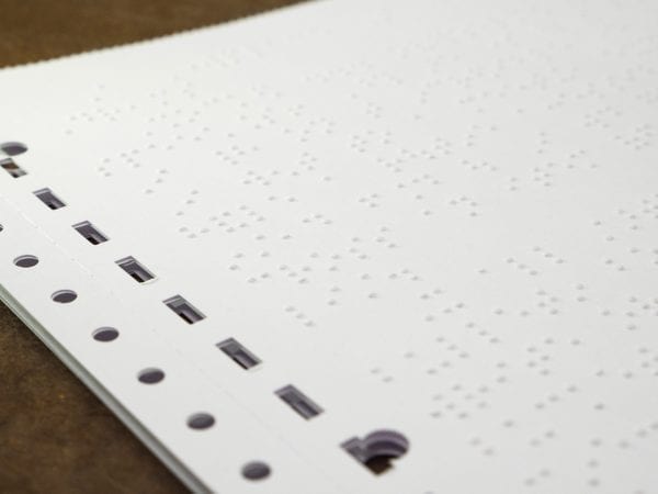 White Fanfold Tractor Feed Braille Transcribing Paper Close up