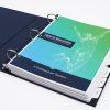 The first page of an open blue Health Education guidebook binder. Printed on the blue and green page is the title of the book and a white geometric graphic of a jumping woman. The binder contains section divider tabs.