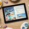 A tablet sitting on a table displaying the Code Jumper Puzzle – Arrrrr, where be the treasure? On the tablet’s screen is an image of CJ, a blue cat-like creature, wearing a pirate's hat and looking through a telescope. Code Jumper pods lay on the table surrounding the tablet.