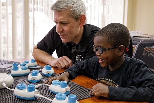 APH President, Craig Meador and student assemble a Code Jumper sequence