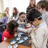 teacher and students assemble a Code Jumper sequence