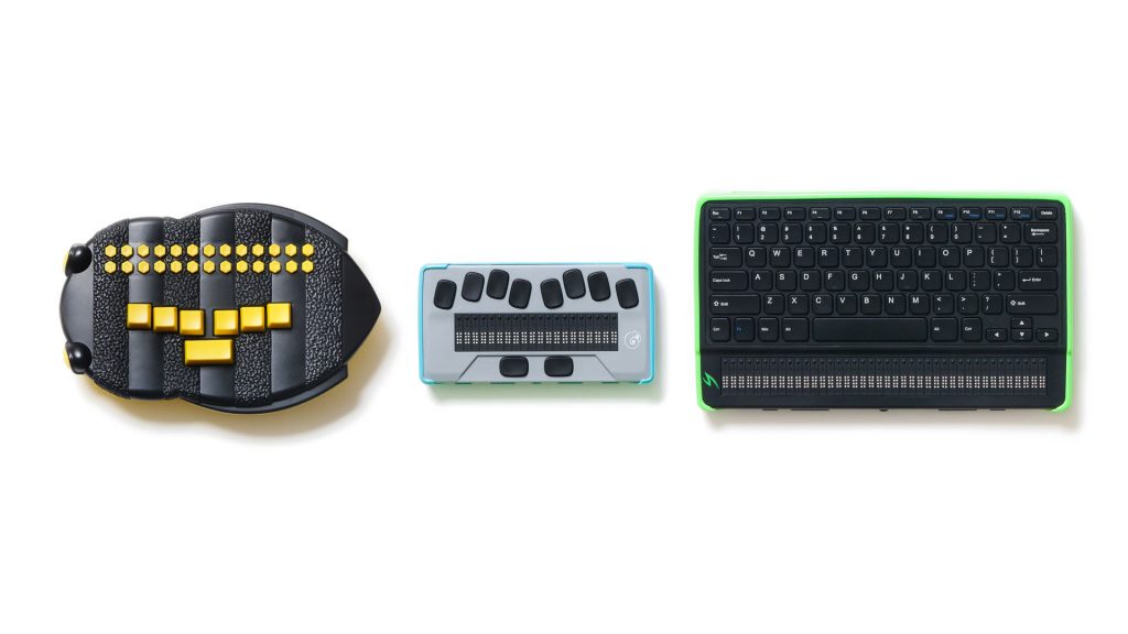 three devices in a line on a white background. First is the braille buzz with a black bee shaped body and yellow buttons, next is the chamemelon 20 with a light gray body and black buttons, and last is a mantis q40 with a black body and qwerty keyboard.
