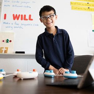 Smiling child with Code Jumper