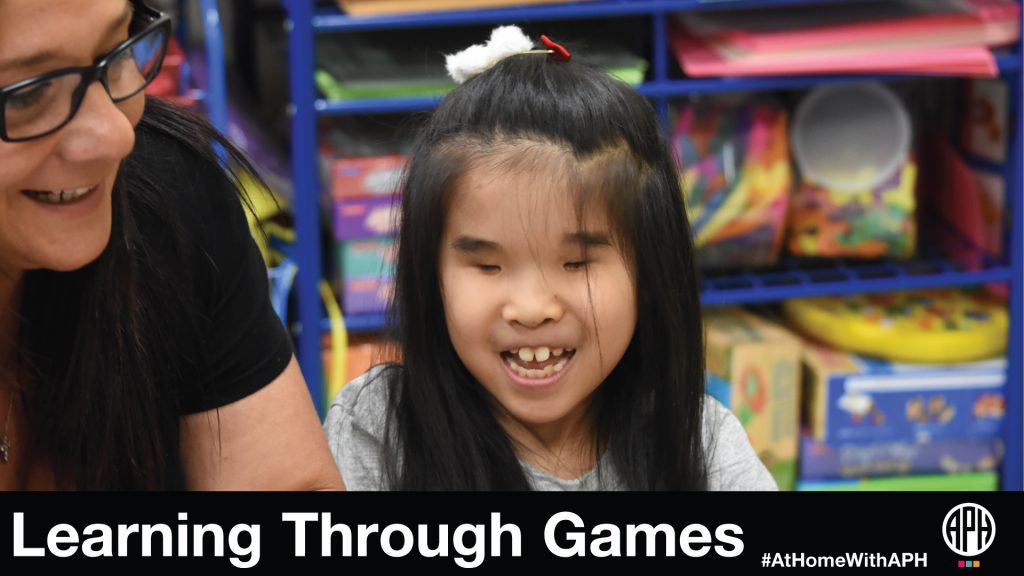 a young girl smiling and playing with a woman. Text reads 