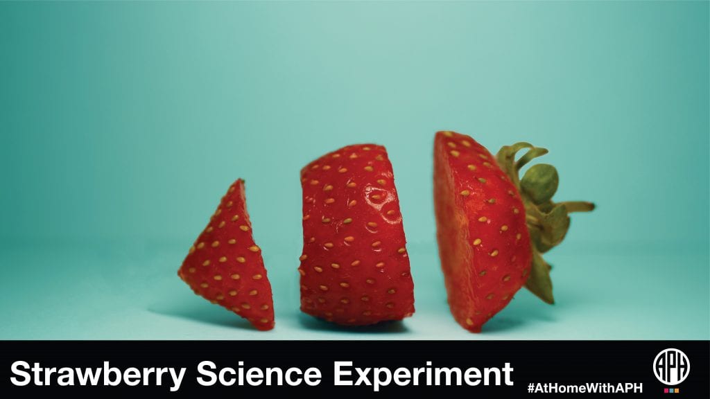 image of a strawberry sliced on a blue background. text reads 