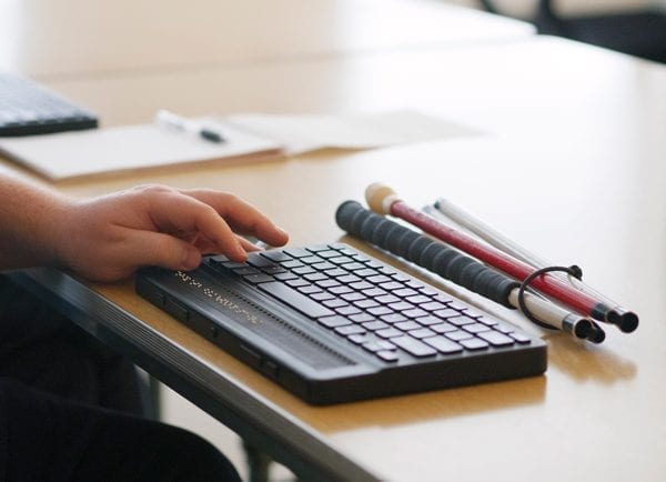 User interacting with the braille display