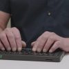 Close up of user typing on the Mantis Q40