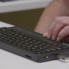 User reading the refreshable display of the Mantis Q40