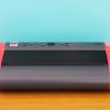 page blaster embosser on a desk in front of a blue wall