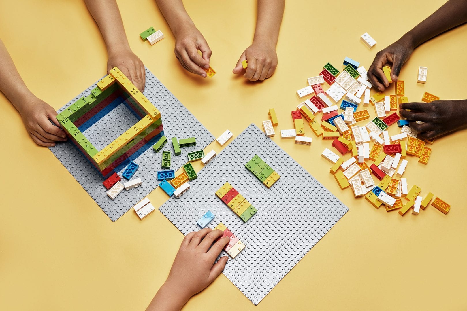 Group of children learning through play with LEGO Braille Bricks