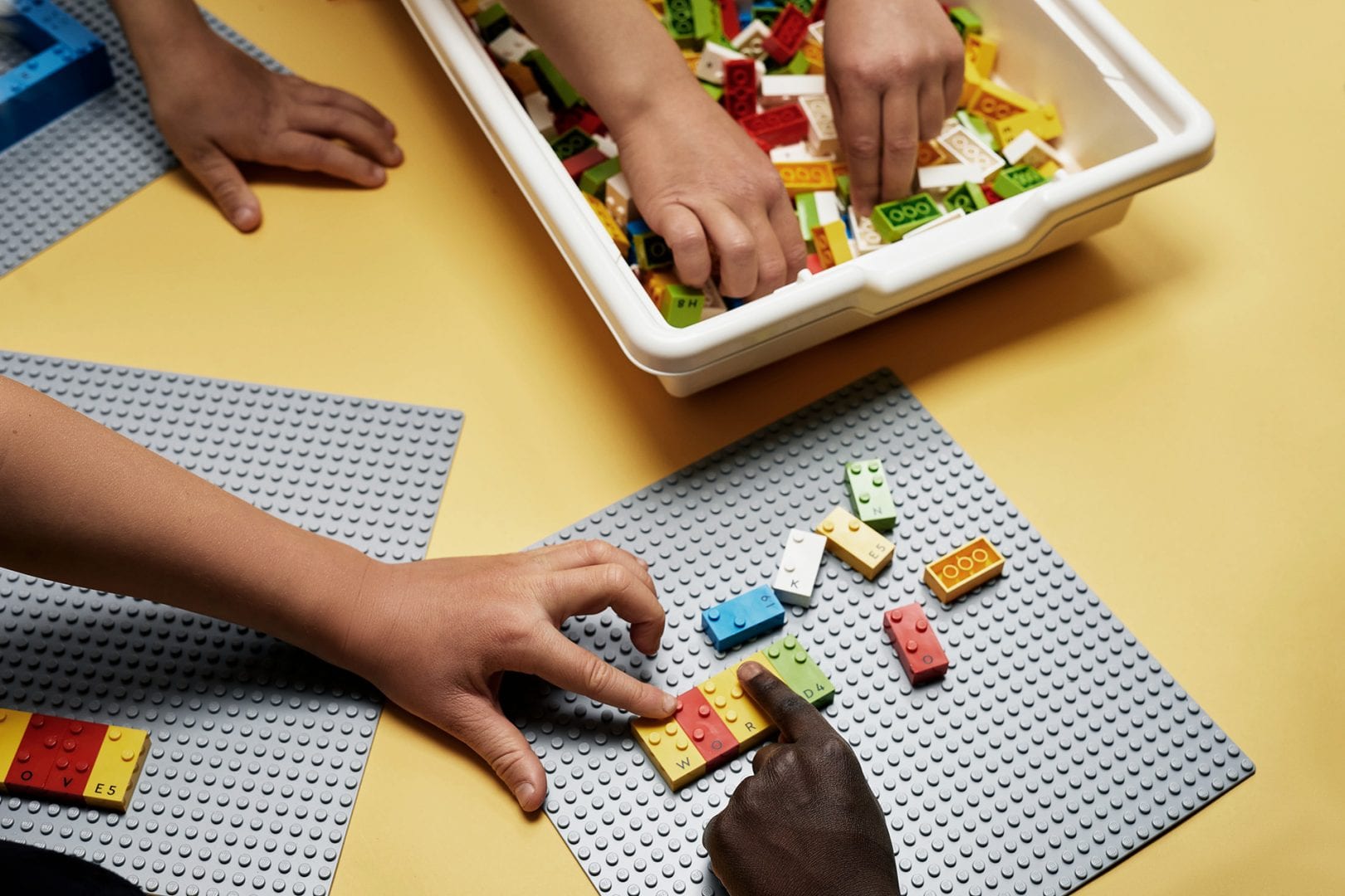 Group of children learning through play with LEGO Braille Bricks 02