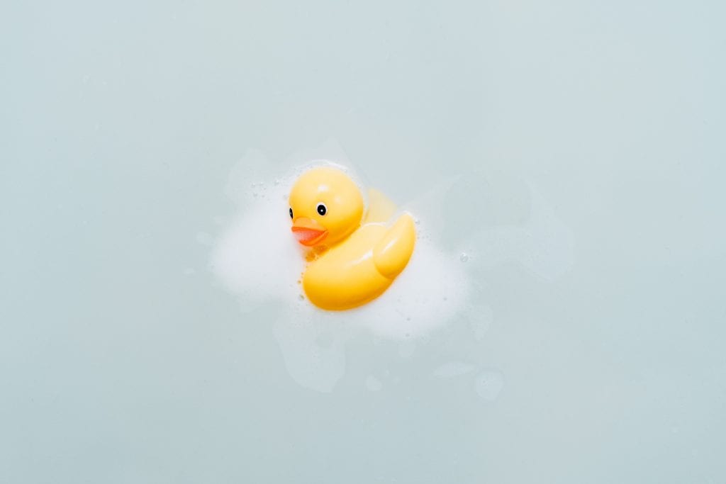 a rubber ducky floating water