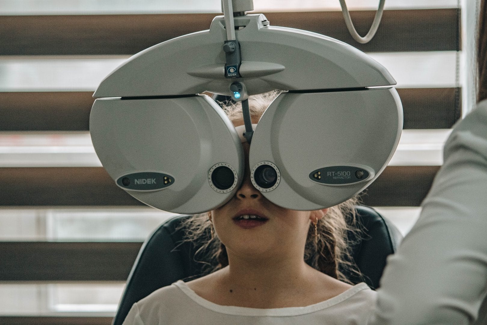 a girl having at eye exam