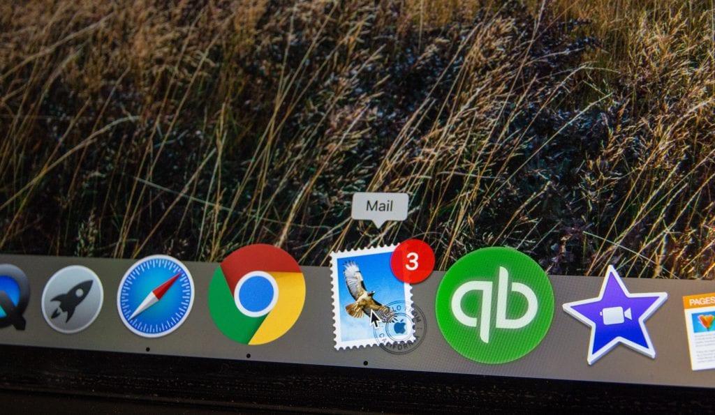 a menu bar of a computer screen showing the icons for different features including an email icon with a notification for 3 new emails