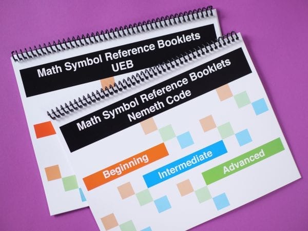 Math Symbols Reference Booklet covers with symbols featuring either Nemeth or UEB symbols on spiral notebooks