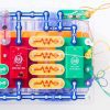 snap circuits pieces assembled including battery packs and wires, to build RC Snap Rover