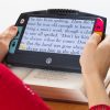 Juno device magnifying book text for a reader