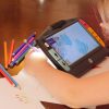 Juno magnifying a handrawn picture as user colors the image