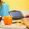 Juno displaying a magnified recipe with food and kitchen utinsils