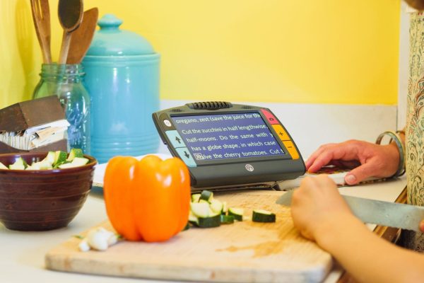 Juno displaying a magnified recipe with food and kitchen utinsils