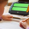 Juno magnifies a text book with green font and text