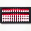 abacus with white beads, a red background, and a black frame