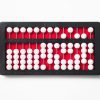 abacus with white beads, a red background, and a black frame