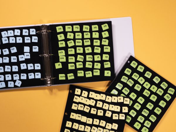 Word PlayHouse kit laid out including black felt board and yellow and white word manipulatives.